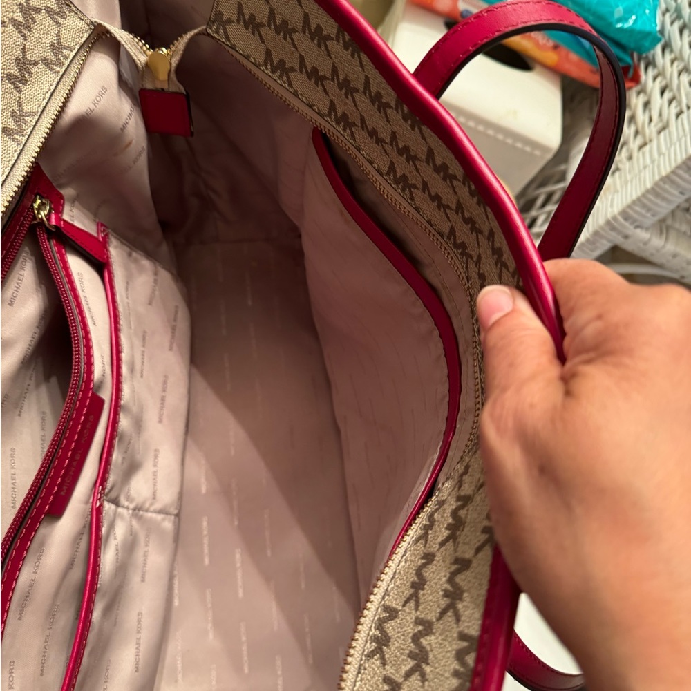 Michael Kors tote 19 length 11 wide zippered closures outside and out. 3 inside - Picture 11 of 11